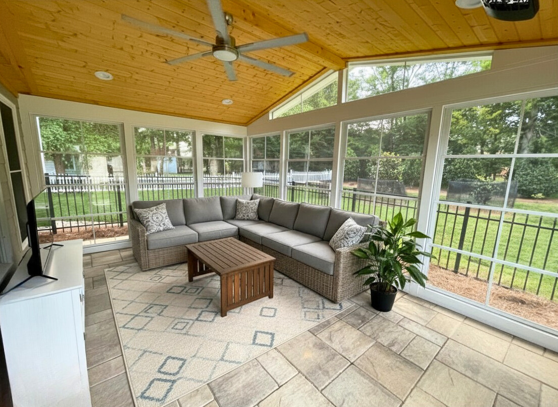 Patio enclosure with eze-breeze windows, paver floor, and enclosed ceiling.